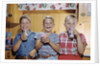 Happy Children Enjoying Glass of Cold Milk by Anonymous