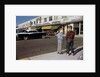 Boys Standing Alongside Strip Mall Parking Lot by Anonymous