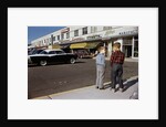 Boys Standing Alongside Strip Mall Parking Lot by Anonymous
