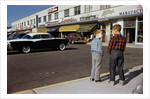 Boys Standing Alongside Strip Mall Parking Lot by Anonymous