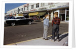 Boys Standing Alongside Strip Mall Parking Lot by Anonymous