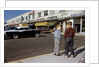 Boys Standing Alongside Strip Mall Parking Lot by Anonymous