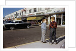 Boys Standing Alongside Strip Mall Parking Lot by Anonymous