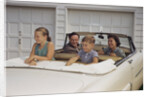 Family Sitting in Car Outside Garage by Anonymous
