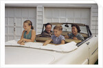 Family Sitting in Car Outside Garage by Anonymous