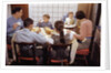 Family Eating Together at Dinner Table by Anonymous