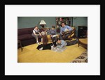 Family Sitting Around Living Room by Anonymous