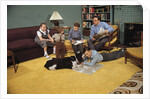 Family Sitting Around Living Room by Anonymous