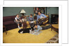 Family Sitting Around Living Room by Anonymous