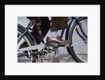 Man Riding Bicycle in Dress Shoes by Anonymous