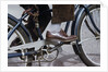 Man Riding Bicycle in Dress Shoes by Anonymous