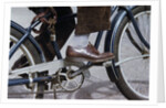 Man Riding Bicycle in Dress Shoes by Anonymous