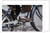 Man Riding Bicycle in Dress Shoes by Anonymous