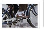 Man Riding Bicycle in Dress Shoes by Anonymous