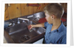 Boy Getting Glass of Tap Water by Anonymous