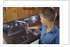 Boy Getting Glass of Tap Water by Anonymous