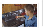 Boy Getting Glass of Tap Water by Anonymous