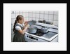 Girl Stirring Soup in Kitchen by Anonymous