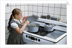 Girl Stirring Soup in Kitchen by Anonymous