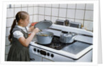 Girl Stirring Soup in Kitchen by Anonymous