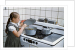 Girl Stirring Soup in Kitchen by Anonymous