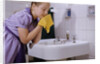 Girl Washing Her Face at Sink by Anonymous