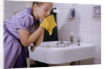 Girl Washing Her Face at Sink by Anonymous