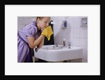 Girl Washing Her Face at Sink by Anonymous