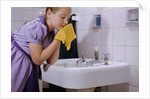 Girl Washing Her Face at Sink by Anonymous