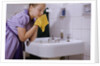 Girl Washing Her Face at Sink by Anonymous