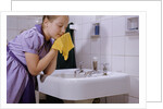 Girl Washing Her Face at Sink by Anonymous