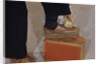Man Buffing His Shoes by Anonymous