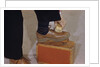 Man Buffing His Shoes by Anonymous