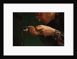 Man Fixing Knob on Screen Door by Anonymous