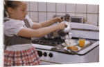 Girl Preparing Breakfast in Kitchen by Anonymous