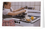 Girl Preparing Breakfast in Kitchen by Anonymous