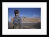 Boy Standing in Schoolyard by Anonymous