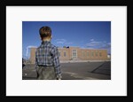 Boy Standing in Schoolyard by Anonymous