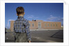 Boy Standing in Schoolyard by Anonymous