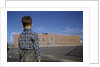Boy Standing in Schoolyard by Anonymous