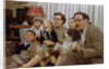 Family Sitting on Couch Together by Anonymous