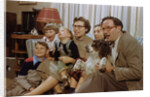 Family Sitting on Couch Together by Anonymous