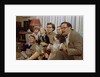 Family Sitting on Couch Together by Anonymous