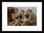 Family Sitting on Couch Together by Anonymous