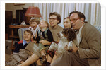 Family Sitting on Couch Together by Anonymous