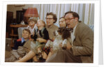 Family Sitting on Couch Together by Anonymous