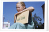 Girl Holding Town History Book by Anonymous