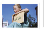 Girl Holding Town History Book by Anonymous