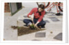 Woman Gardening by Anonymous