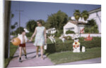 Mother and Son Walking by Christmas Decorations on Yards by Anonymous